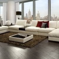 темный угловой диван в дизайне квартиры картинка