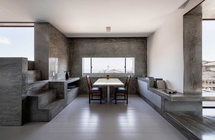 Двухцветный интерьер обеденной зоны на кухне в стиле минимализма