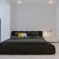 Черная кровать на сером ковролине